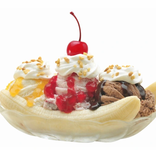 Banana split with vanilla, chocolate and strawberry ice cream, whipped cream and a cherry